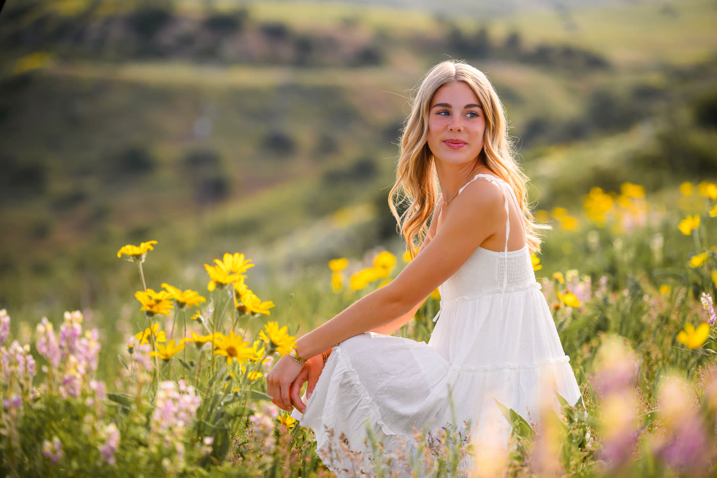 Senior portrait session in a Southern Idaho wildflower field at golden hour
